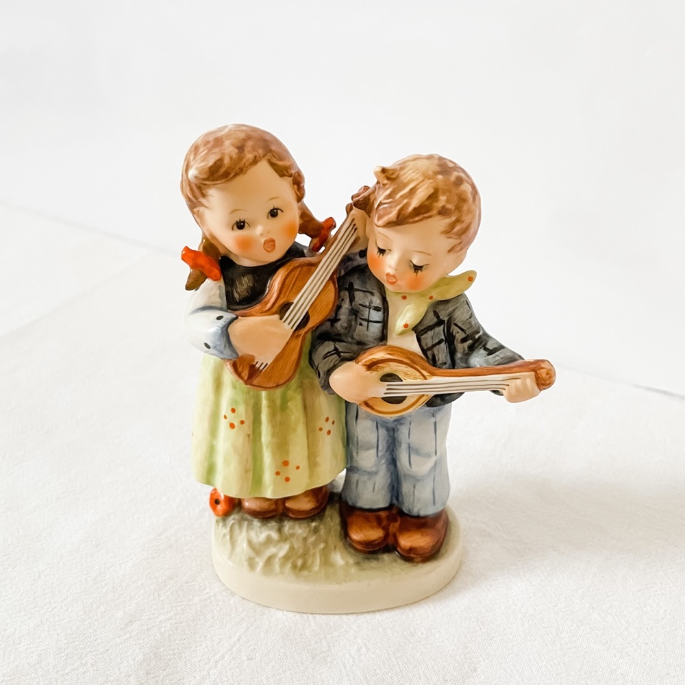 Boy and girl with instruments Hummel